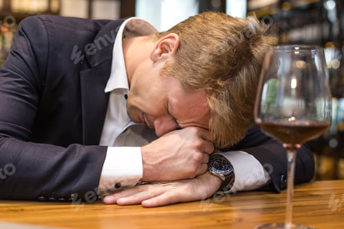 Preview: Businessman Hangover Suffering When He Drunk Wine At Bar, Man With Alcoholism Concept., Man Dronk