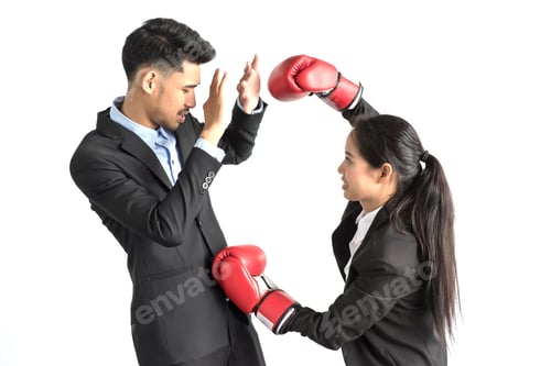 Preview: Portrait Of Aggressive Business Lady In Boxing Gloves Kicking His Rival