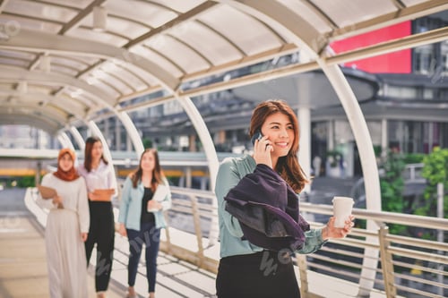 Preview: Business Communication Concepts, A Young Business Woman Is Playing Her Mobile Phone.