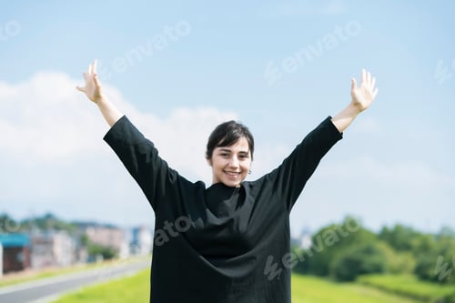 Preview: A Young Woman Showing A Relaxed Expression Under The Blue Sky