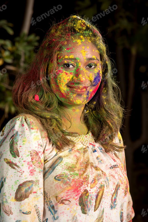 Preview: Portrait Of Happy Young Girl On Holi Color Festival. Girl Posing And Celebrating Festival Of Colors.