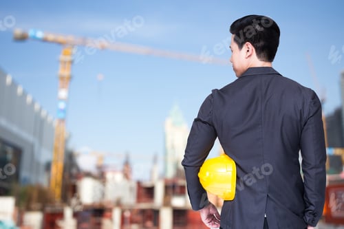 Preview: Architect Standing With Helmet In Hands, Outdoor Construction Concept, 20-30 Year Old.