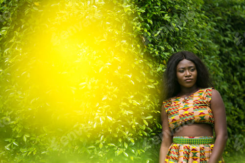 Preview: Woman In African-Print Dress In A Garden.