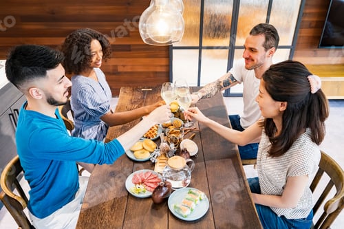Preview: Scene Of A Home Party Where Men And Women Surround The Dining Table