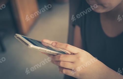 Preview: Afternoon Scene Of Young Woman Using Smartphone For Social Networking In Cafe On Weekend. Weekend