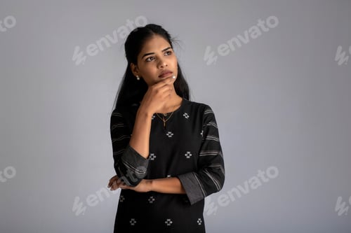 Preview: Portrait Of A Young Girl Posing On Gray Background