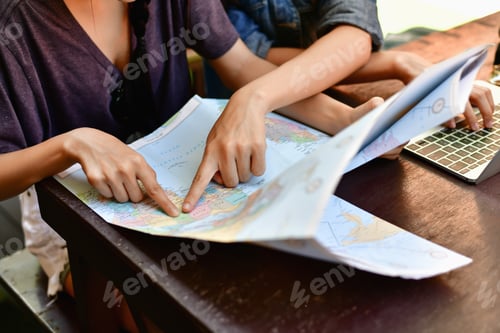 Preview: A Tourist Girl Searching For Accommodation On The Internet And Map.