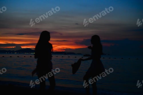 Preview: Blurry Image, Happy Carefree Woman Enjoying Beautiful Sunset On The Beach