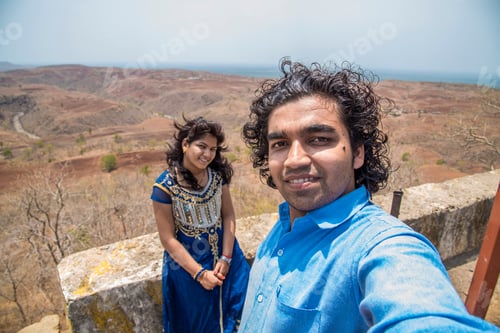 Preview: Indian Couple Taking A Selfie. Man Taking A Selfie With His Wife Or Girlfriend In The Mountains.