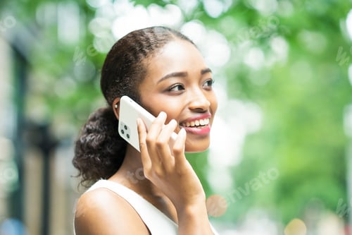 Preview: Young Business Woman Calling By Putting A Smartphone On The Ear