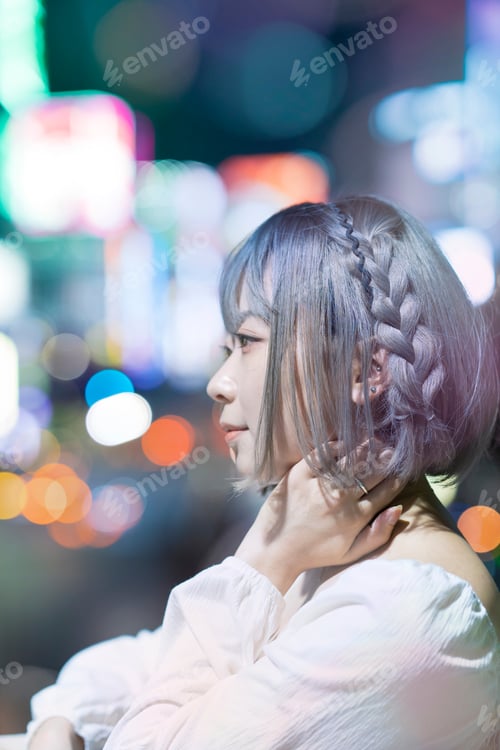 Preview: Young Woman Posing In The Glowing Cityscape Of Tokyo At Night