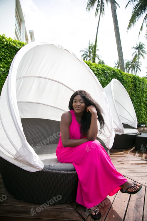 Preview: Youthful African Woman Relaxing By The Pool On Summer Holidays.