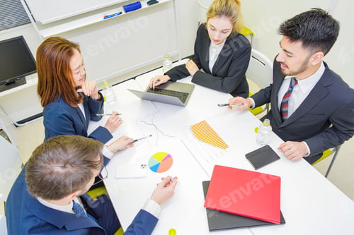 Preview: Business People Discussing In A Meeting Room