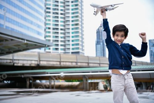 Preview: Children'S Play Concept. The Boy Is Playing With Toys. Boy Playing Toy In The City.