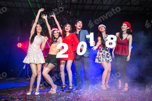 Preview: Group Of Young Asian People Holding Wording 2018 Together In Nightcub. People Have A Party Together