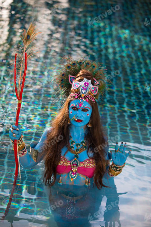 Preview: Buddhist Deity: Woman With Face & Body Paint In The Water.