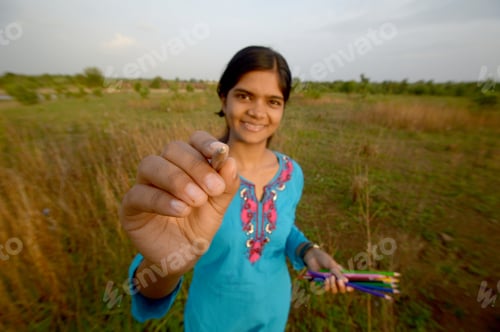 Preview: Beautiful Girl Writing And Holding Color Pencils In Outdoors