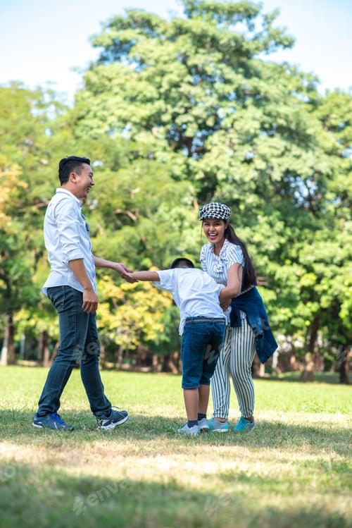 Preview: Happy Children And Parents Playing In The Park. Concept Family Relaxation.