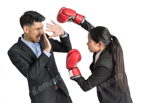 Preview: Portrait Of Aggressive Business Lady In Boxing Gloves Kicking His Rival