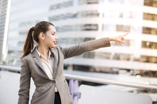 Preview: Young Asian Businesswoman Pointing Direction To The Future With Attractive Smiling At City. Woman