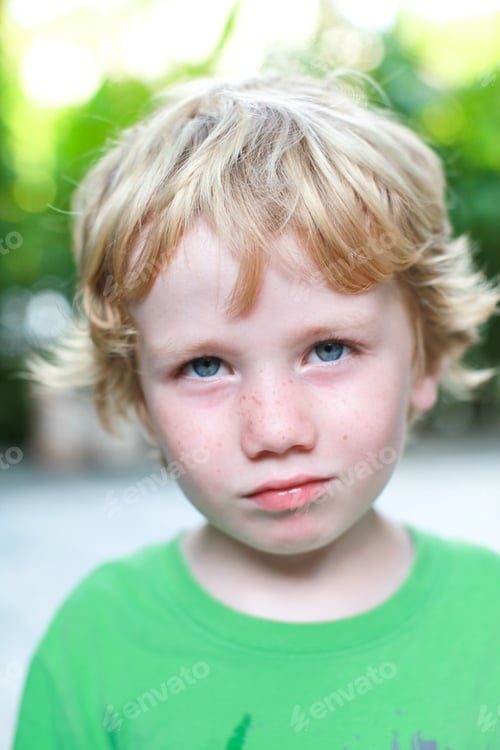 Preview: Portrait Of A Cute Young Boy With Blond Hair And Blue Eyes.