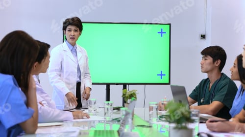 Preview: The Doctor Is Explaining The Meeting By Previewing On A Green Screen.