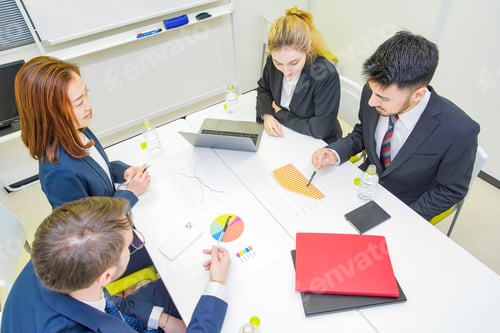 Preview: Business People Discussing In A Meeting Room
