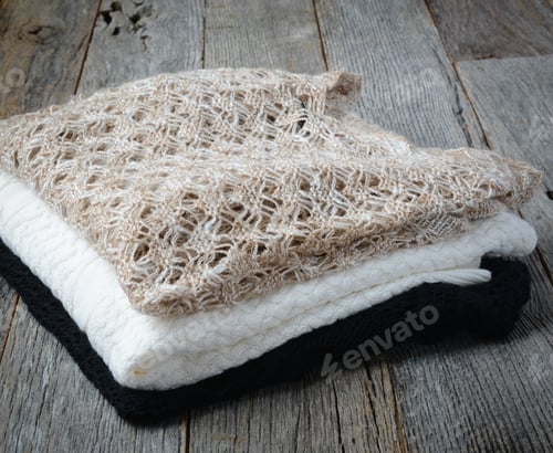 Preview: Close Up Of Sweaters On Wooden Background