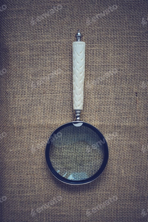 Preview: Magnifying Glass On Vintage Burlap Background With Instagram Style Filter