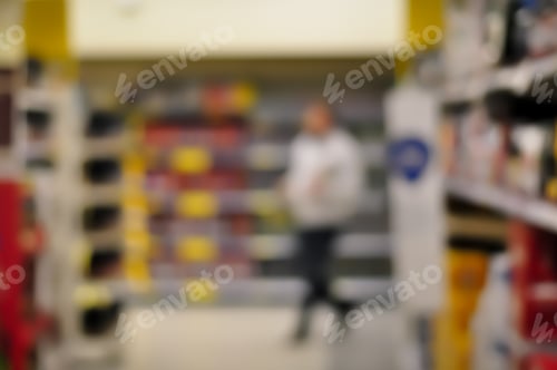 Preview: Blurred Interior Image. Inside Of Grocery Store With Brightly Color Merchandise.