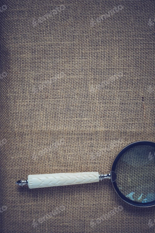 Preview: Magnifying Glass On Vintage Burlap Background With Instagram Style Filter