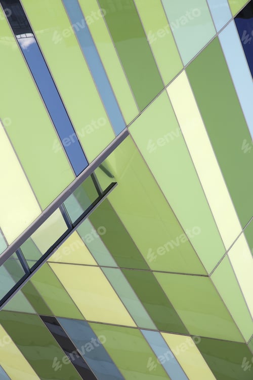 Preview: Modern Building Facade with Green and Blue Panes