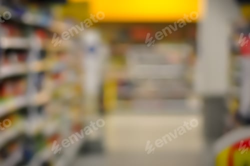 Preview: Blurred Interior Image. Inside Of Grocery Store With Brightly Color Merchandise.