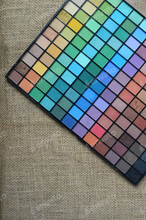 Preview: Colorful Cosmetic Eye Shadow Palette on Burlap Surface