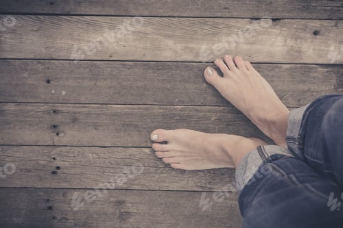 Preview: Feet. First-Person View On Rustic Wood Floor Background.