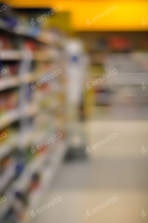 Preview: Blurred Interior Image. Inside Of Grocery Store With Brightly Color Merchandise.