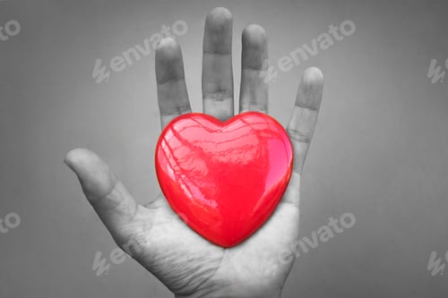 Preview: Isolated Hand Holding Heart. Giving Love Concept.