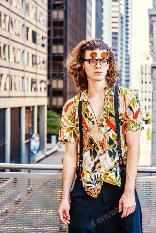 Preview: Young Hispanic American Man With Long Brown Curly Hair, Wearing Double Lens Sunglasses, Colorful