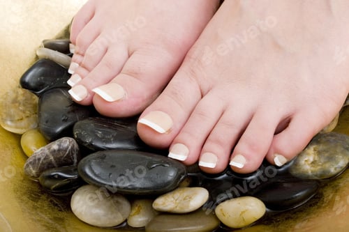 Preview: Woman'S Feet In Bowl Of Water And Rocks