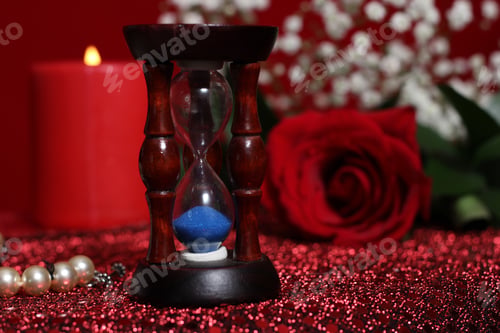 Preview: Candle With Hourglass, Rose And Jewelry Box On Red Velvet Background