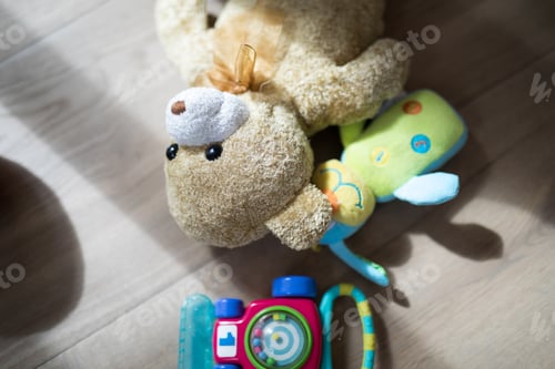 Preview: Overhead Of Toys On Wooden Floor