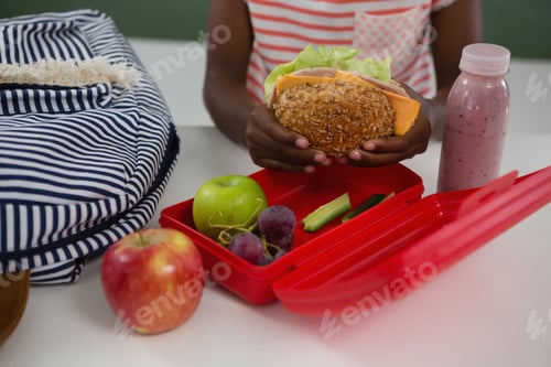 Preview: Mid-Section Of Schoolgirl Having Sandwich