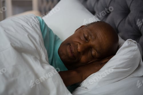 Preview: Senior Man Sleeping On Bed At Home