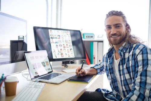 Preview: Portrait Of Male Executive Sitting At His Desk In Office