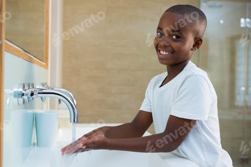 Preview: Portrait Of Smiling Boy Washing Hands In Sink At Bathroom, Coronavirus Hand Washing For Clean Hands