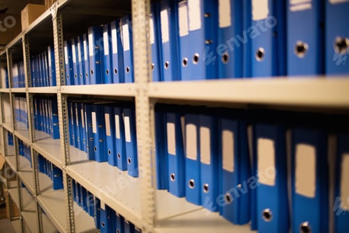 Preview: Blue Files Arranged On Shelves In Storage Room