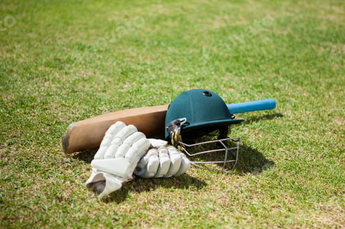 Preview: High Angle View Of Cricket Equipment On Field During Sunny Day
