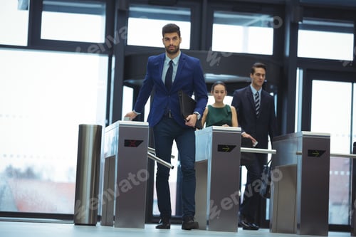 Preview: Businessman Passing Through Turnstile Gate At Office