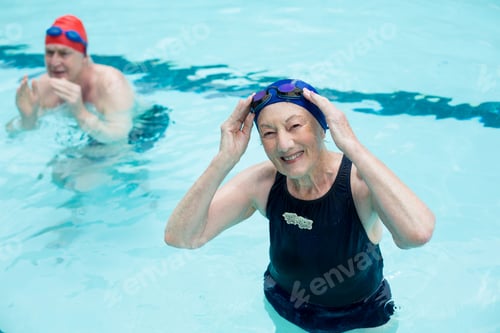 Preview: High Angle View Of Senior Man And Woman Swimming In Pool