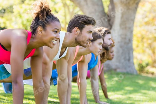 Preview: Group Of Friends Exercising In Park